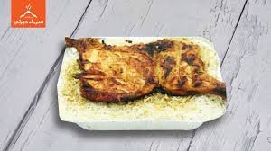 نصف دجاجة مشويه على الفحم مع أرز مع بيبسى